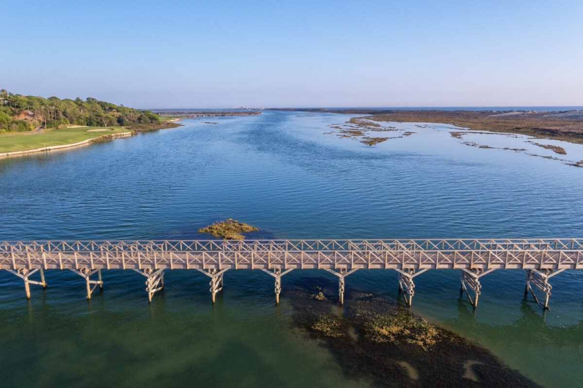 An aerial view of the Quinta do Lago bridge with golf course on left hand side.