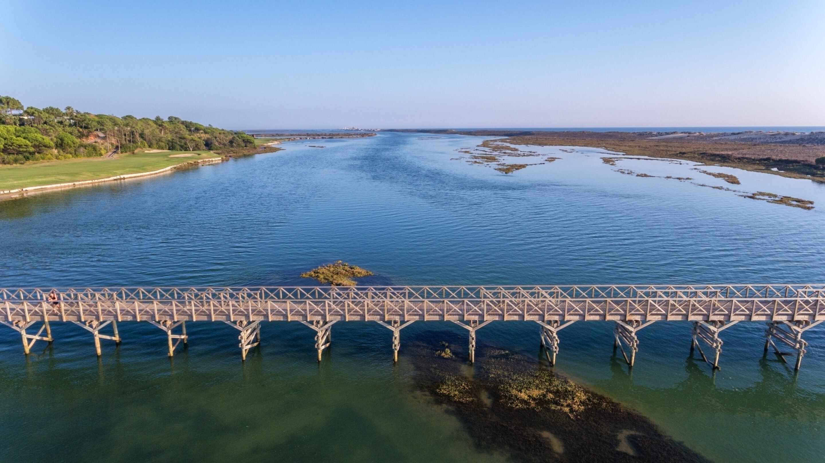 An aerial view of the Quinta do Lago bridge with golf course on left hand side.