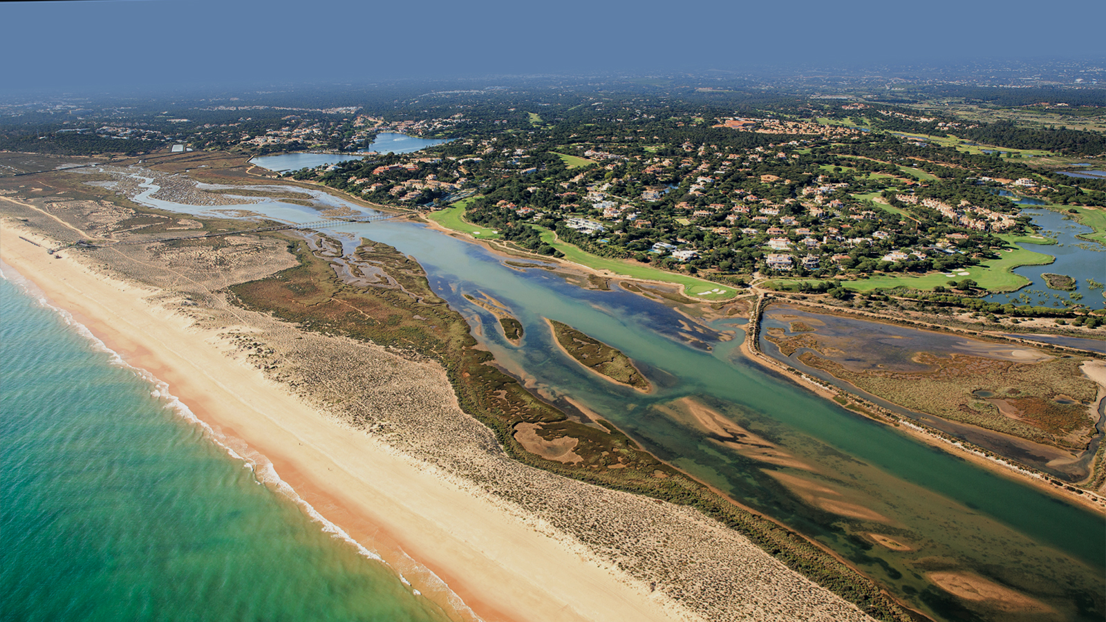 An aerial view of the beach and coastline by Quinta do Lago in Portugal